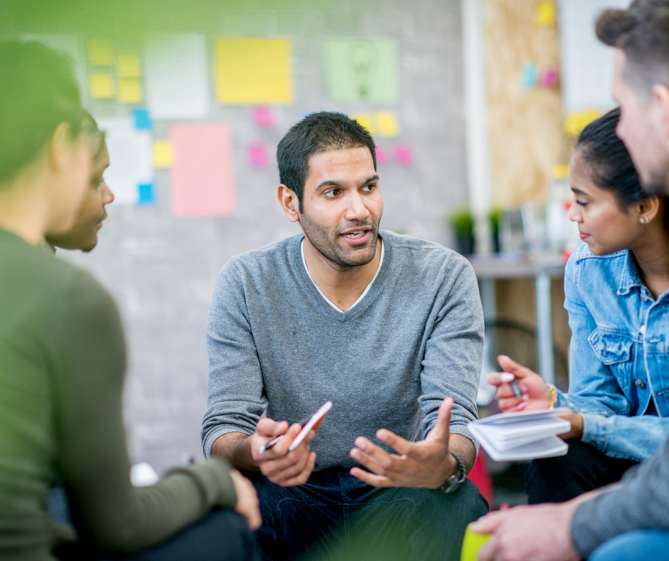 Staff attending a staff meeting