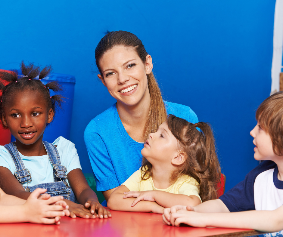 Nursery practitioner with children