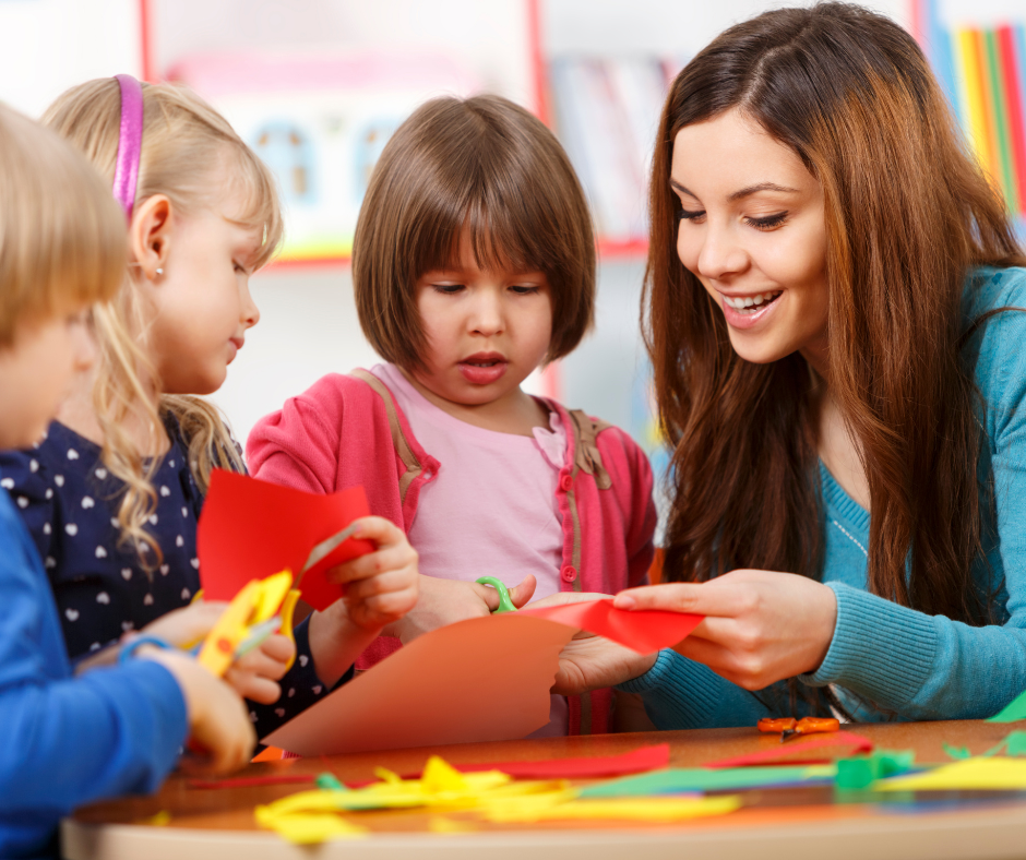 nursery teacher interacting with children