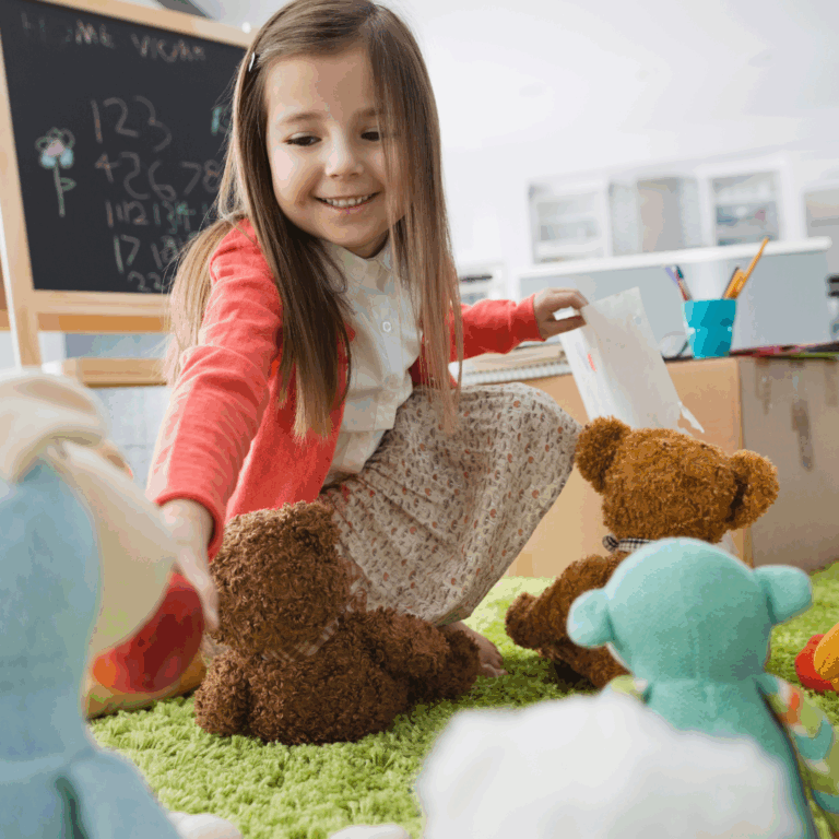 A child pretending they are a teacher with their teddy bears.