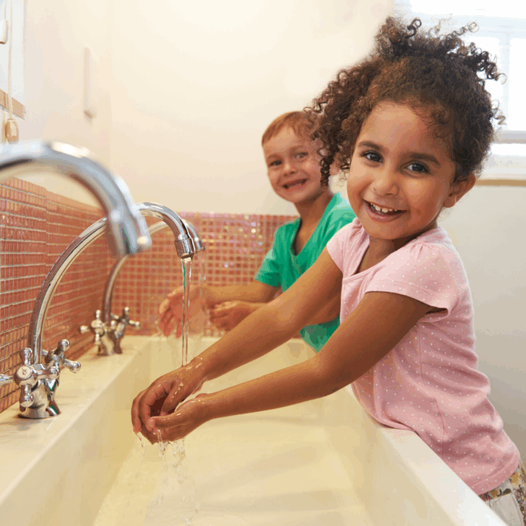 A child practicing washing her hands