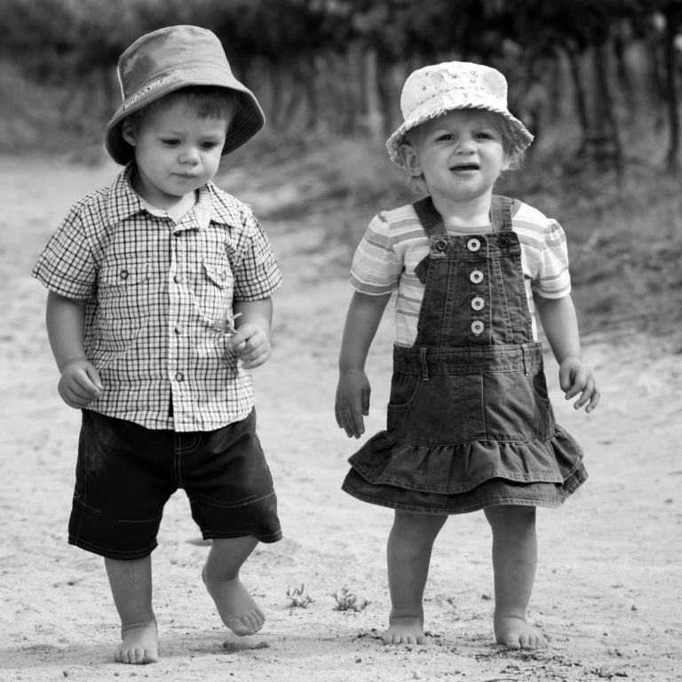 An image of a 2 year old boy and girl