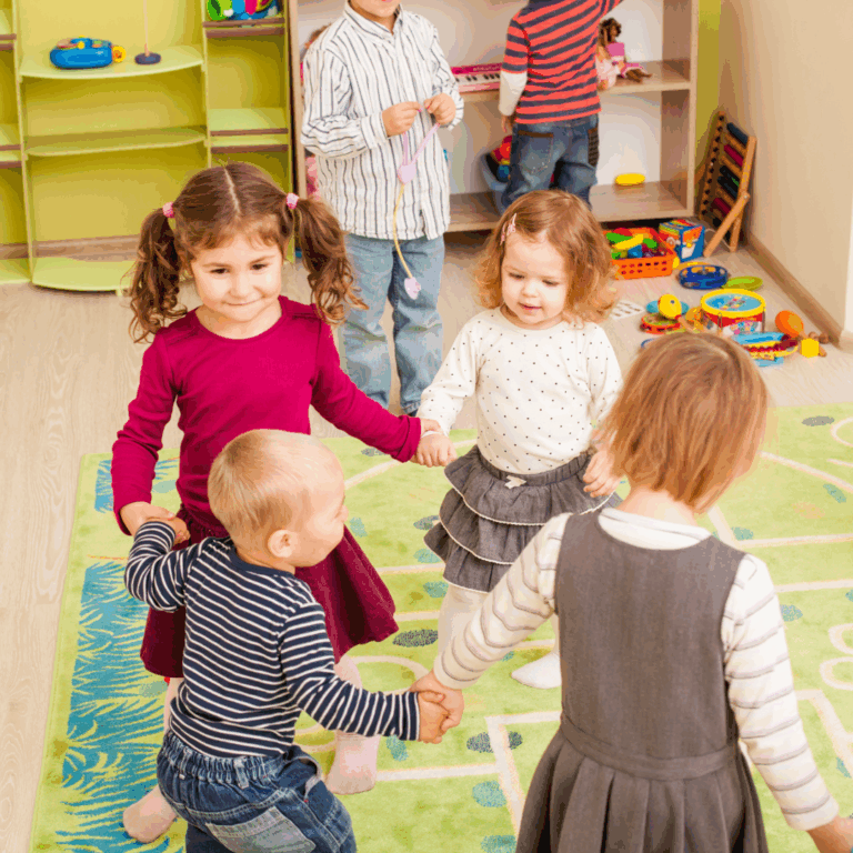 Preschoolers holding hands in a ring