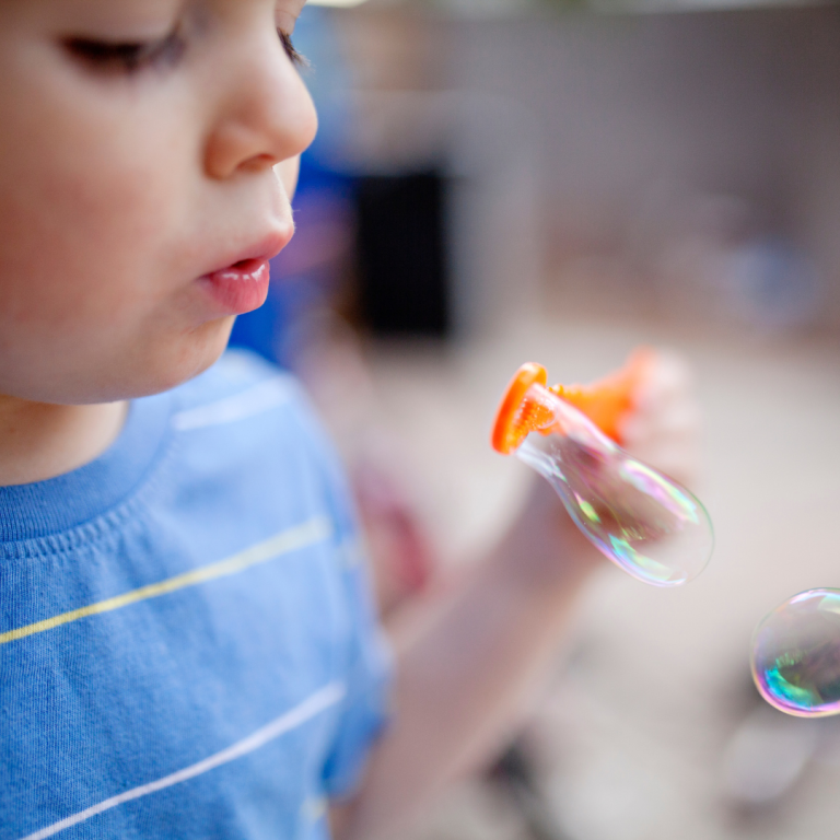 A child blowing bubbles