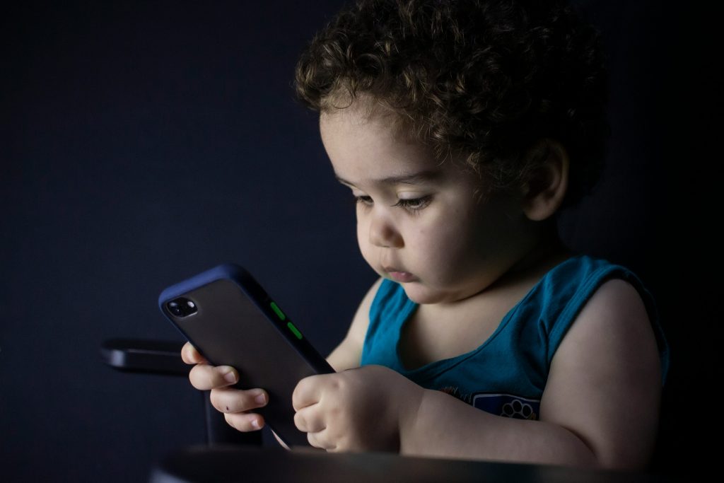 An image of a child using a mobile phone