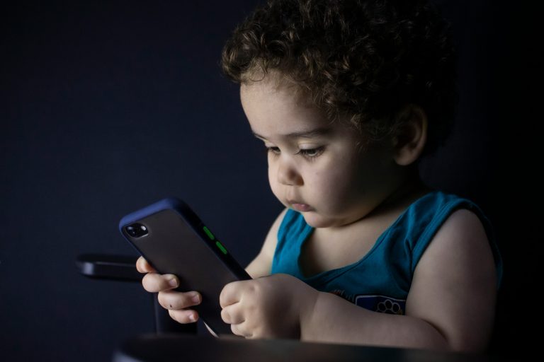 An image of a child using a mobile phone