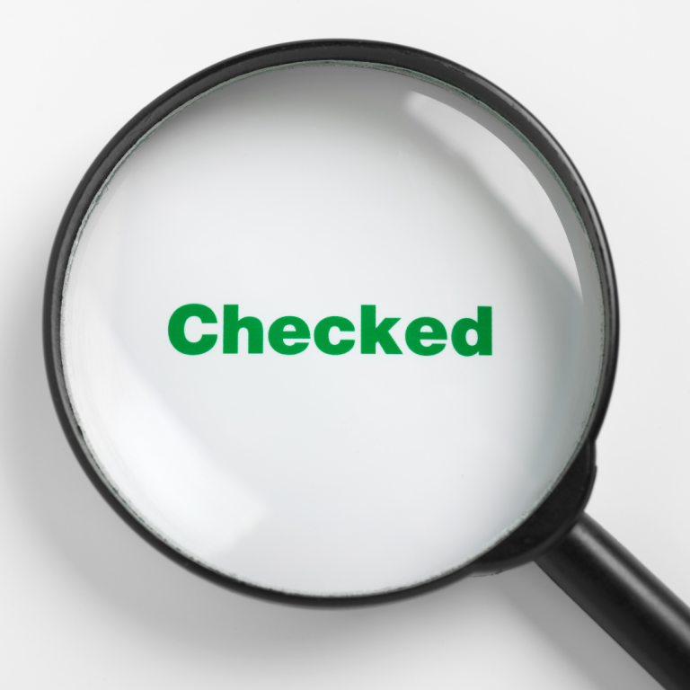 An image of a magnifying glass over the word Checked