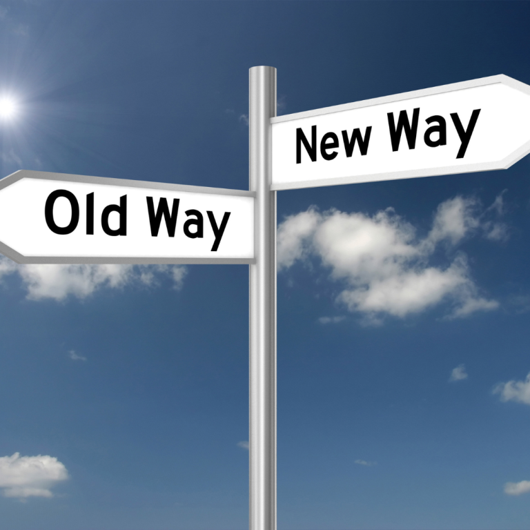 A image of 2 signs at a junction labelled Old Way New Way