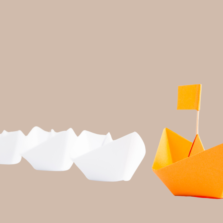 An image of paper boats with the first in line being yellow and with a flag to represent leadership