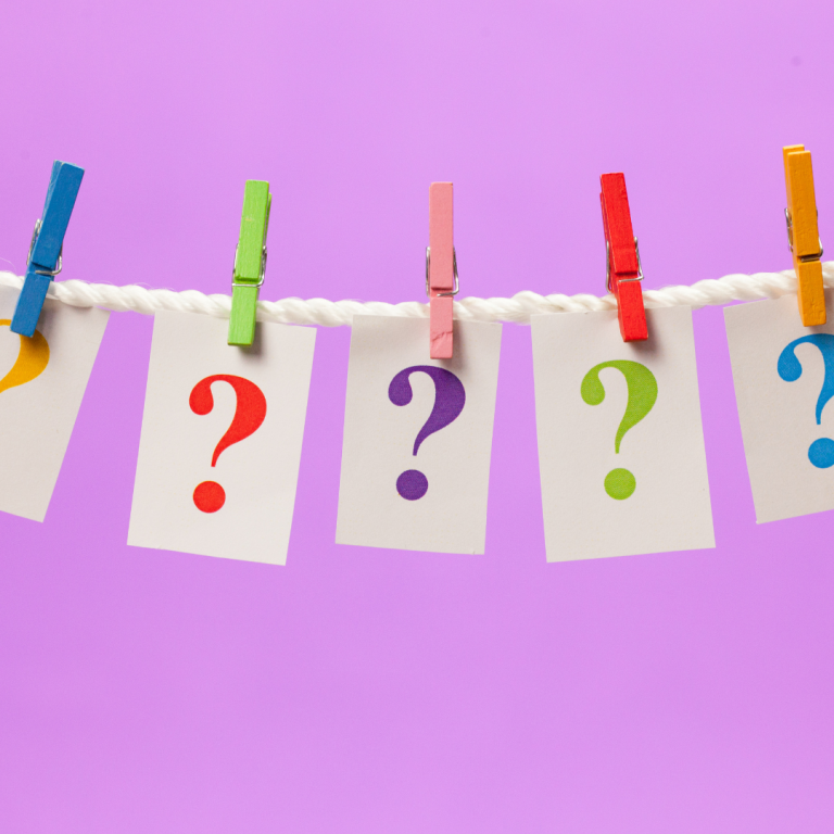 An image of question marks hanging on a washing line to illustrate open ended questions