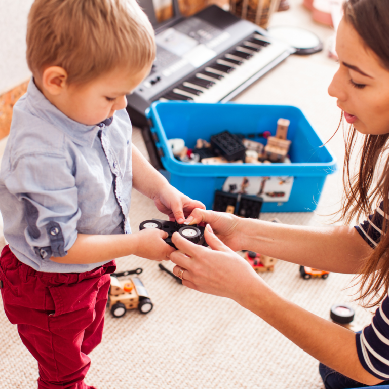 An adult supporting a child to regulate their emotions