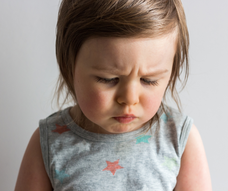 An image of a preschooler looking worried for a blog about the DSL role in safeguarding