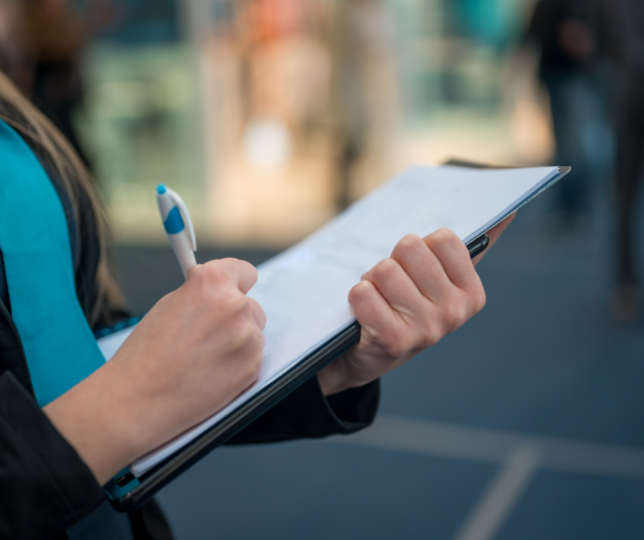 An image of an inspector holding a clipboard
