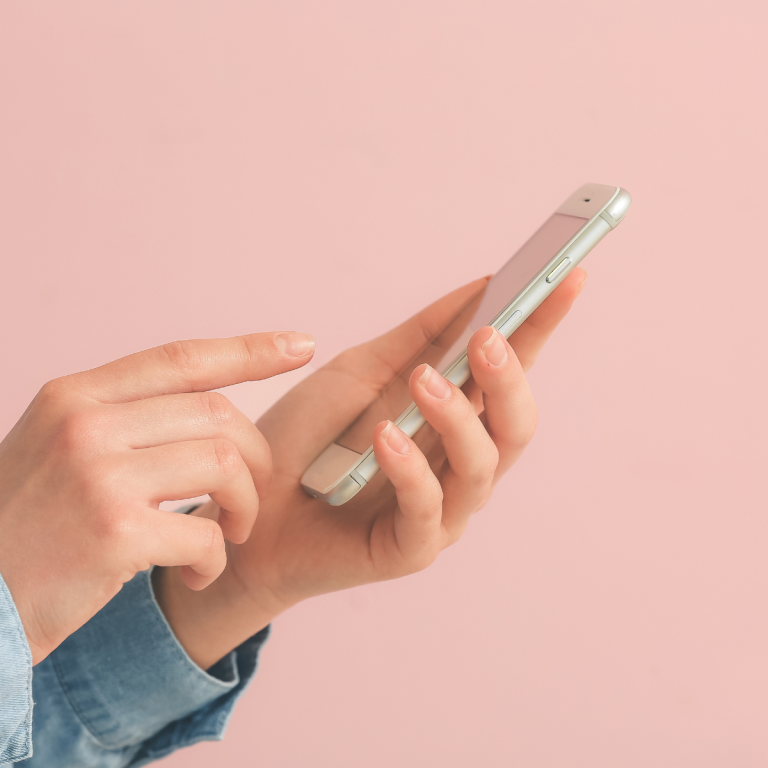 An image of a woman scrolling on a phone